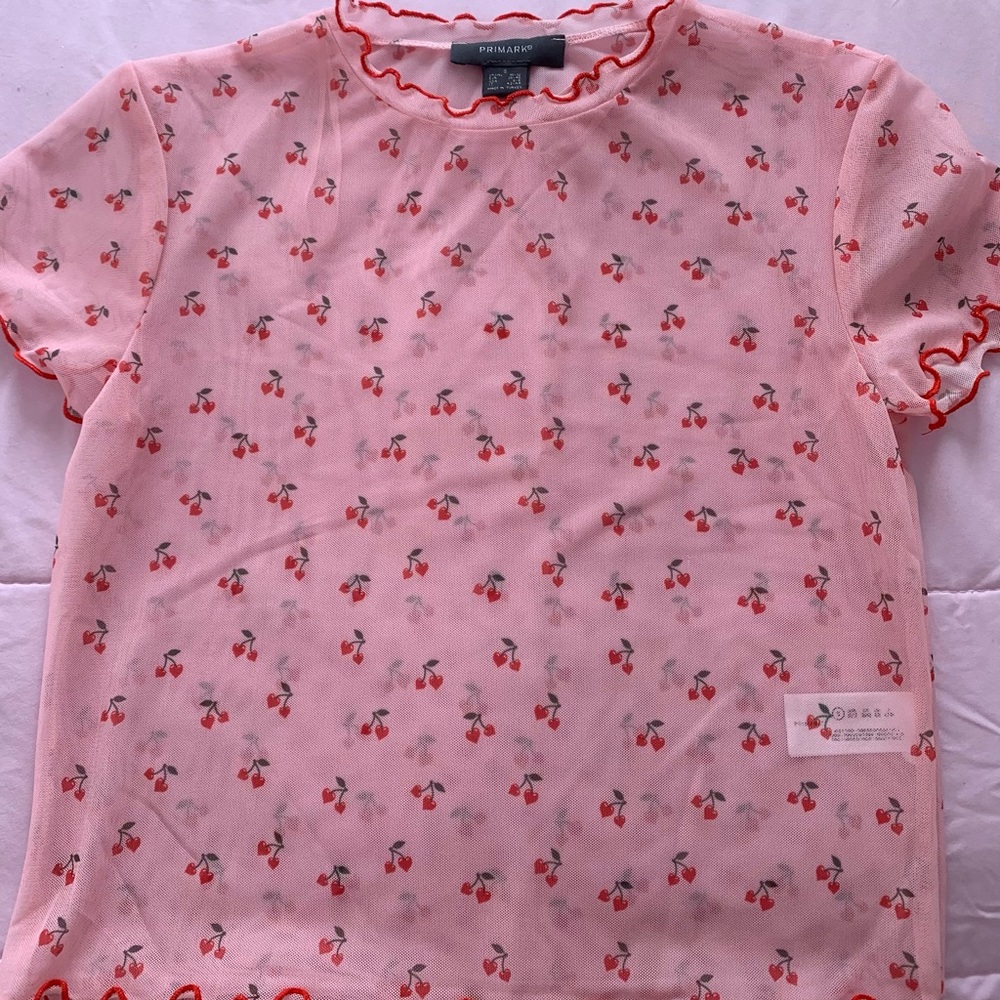Pink transparent top.
